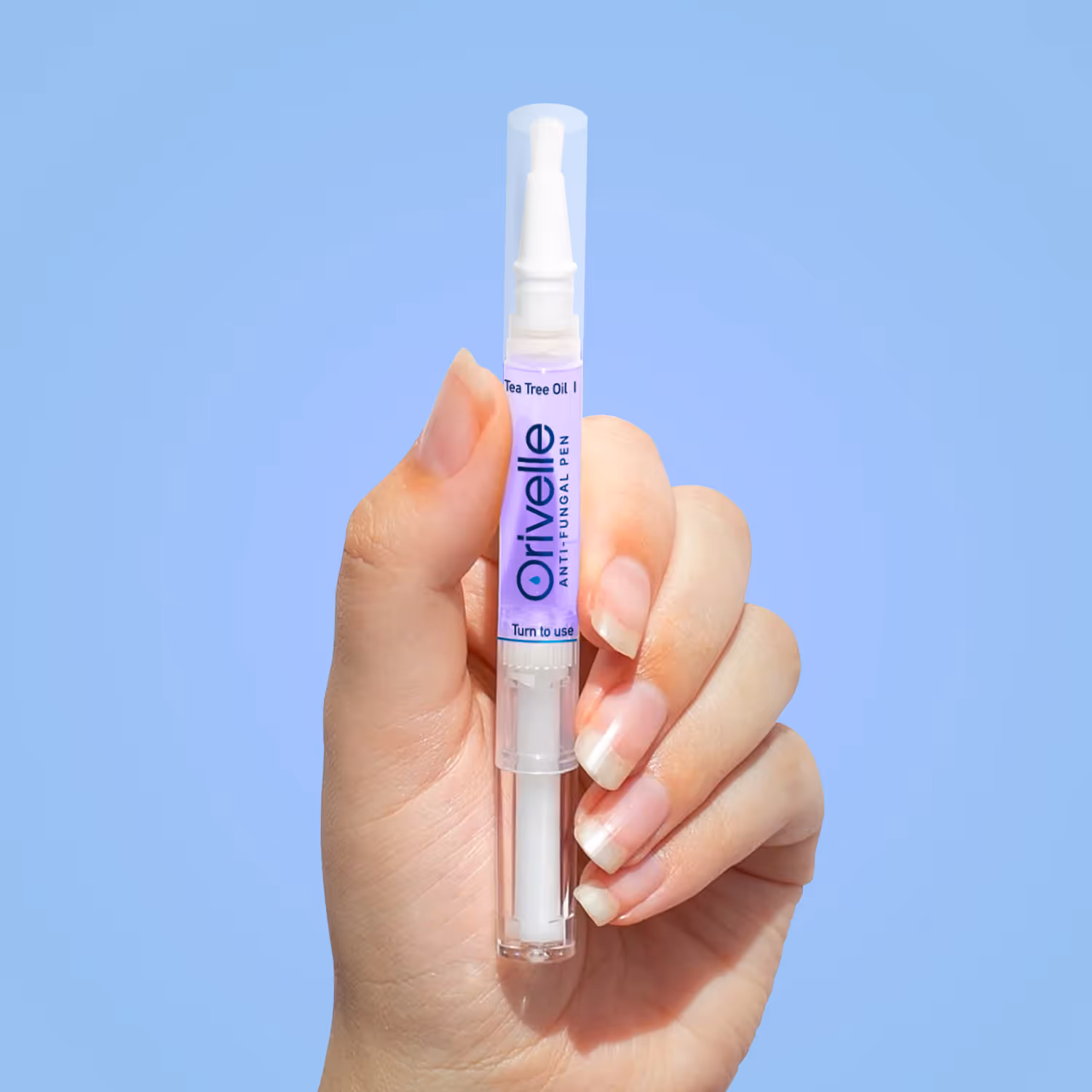 Orivelle Nail Care Pen held in a hand